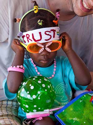Little girl trying on gifts