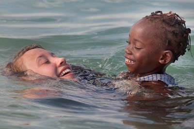 White and black at play in ocean